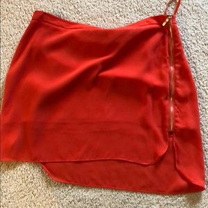 Posh mini skirt with gold zipper detail on sides